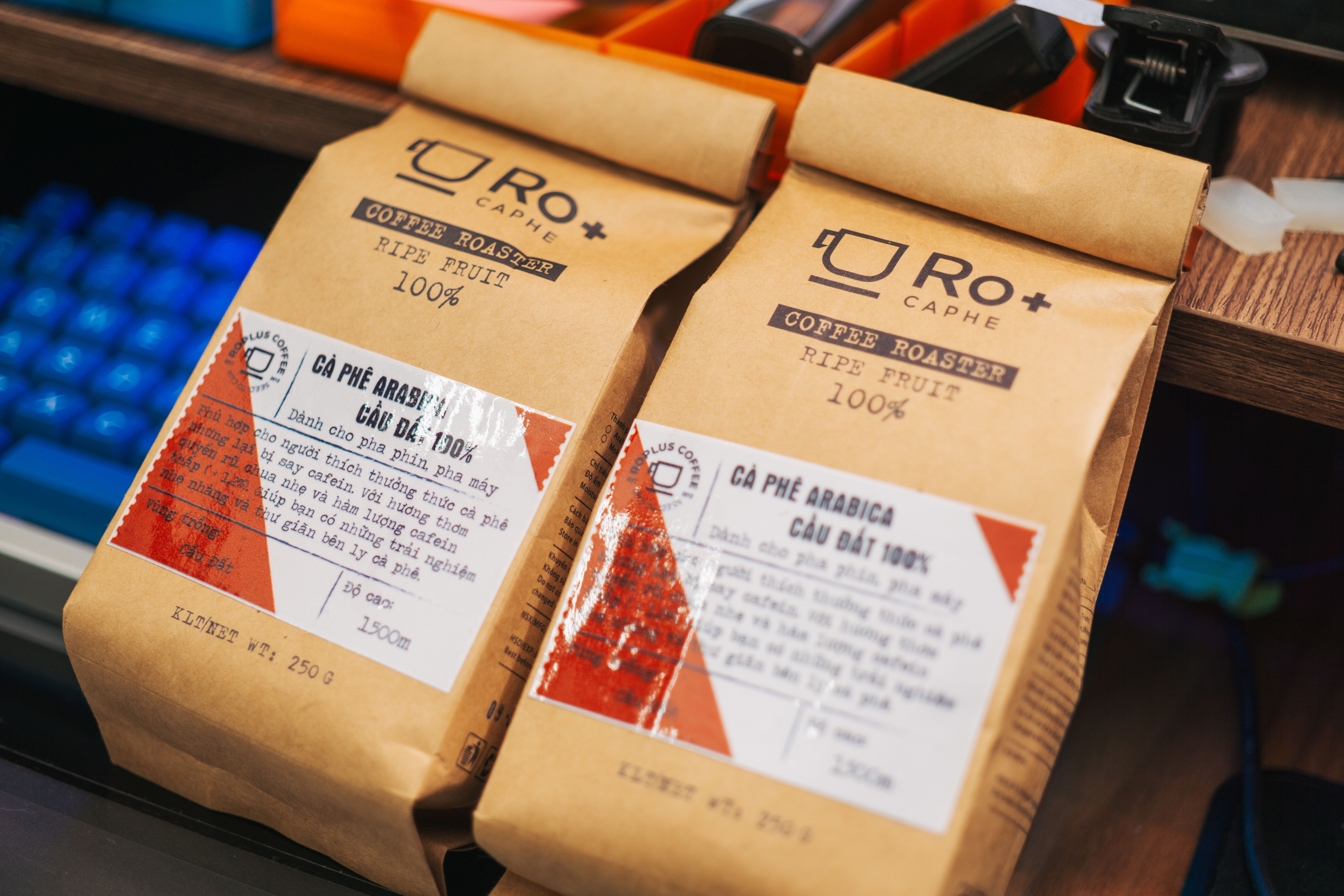 Finished branded coffee stand-up pouches with detailed labels showing the final custom bag product